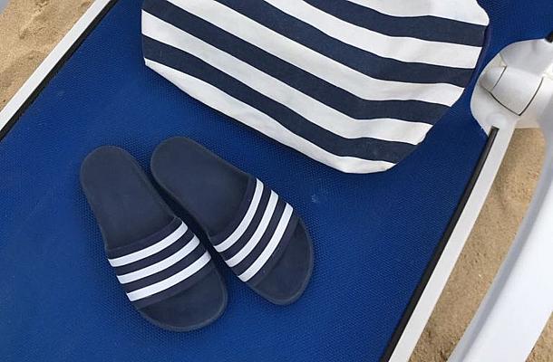 Beach sandals and towel